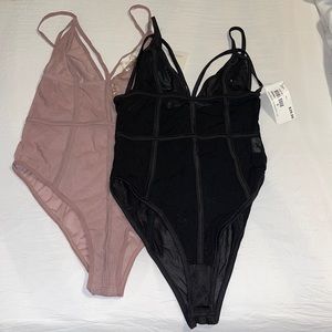 Three women bodysuits black/pinks/tan size small